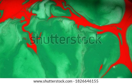 Abstract photographs of color mixing of water, acrylic,oil for use as background image. Acrylic texture with beautiful pattern, close up multi color background photo