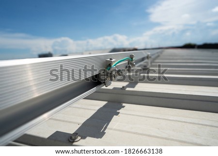 installing grounding in steel bar of solar rooftop power system stock photo