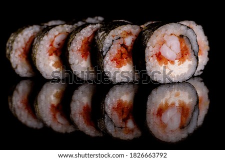 Fresh delicious beautiful sushi rolls on a dark background. Elements of Japanese cuisine