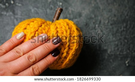nails with pumpkins and autumn leaves. trendy nails design. top view. place for text. flat lay pictures