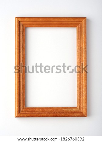 vertical photo of wooden frame on white background.
