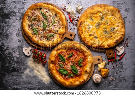 Pizza pattern. Three pieces set on grey concrete background. Top view, copyspace