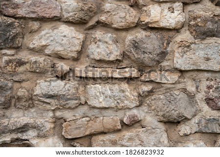 Closeup photo of stone wall background texture 