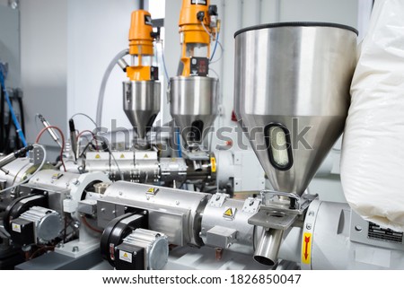 Extruder machine for extrusion of plastic material, close-up view Royalty-Free Stock Photo #1826850047