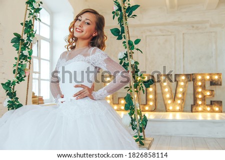 Wedding day and beautiful bride in studio. Beautiful young bride with wedding makeup and hairstyle. Portrait of young gorgeous bride. Wedding. Royalty-Free Stock Photo #1826858114