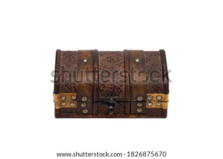 Old wooden ancient closed chest isolated on white background. Money, financial, growth concept.
