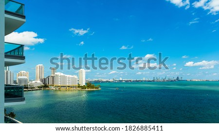 Apartment balcony view of Biscayne Bay along Brickell Bay Drive.