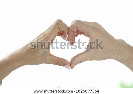 Heart sign made from hands. Male and female hand together depicts heart. Charity concept.