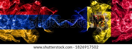 Armenia vs Andorra, Andorran smoky mystic flags placed side by side. Thick colored silky abstract smoke flags