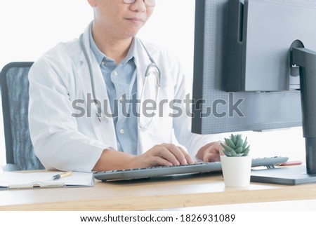 Close-up of a medical worker typing on computer 