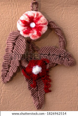 Macrame. Christmas wreath. A hanging base for flowers made of fabric with hands.