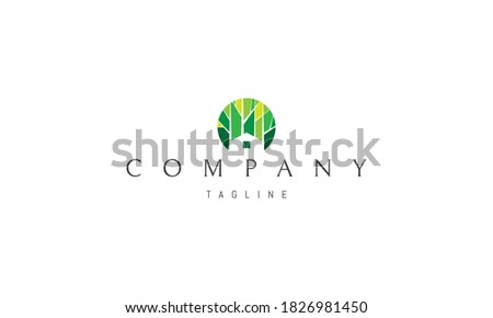 Vector color logo on which an abstract image of the silhouette of a house on a forest background.