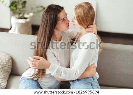 Love, romance, lgbt couple moments. Two young women in love embracing sharing romantic moment together. Happiness, equality, human relationships