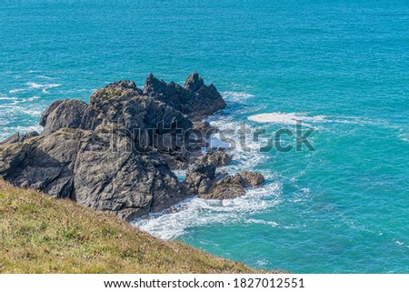 Coastline around Lizard point in Cornwall England on a windy day and rough seas against the rocks