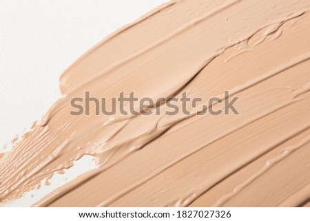 Make-up matte concealer foundation bb-cream smudge powder creamy white isolated background Royalty-Free Stock Photo #1827027326