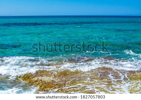 Sea coast and beach with rocks, rocky coastline, blue sea, good 