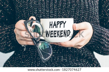 Happy weekend text on cap of coffee