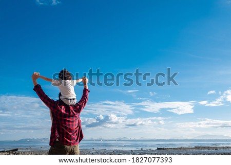 child riding his dad's neck, family time, father's day
