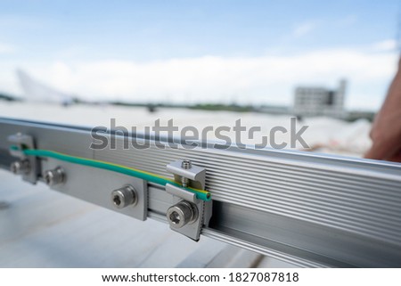 installing grounding in steel bar of solar rooftop power system stock photo