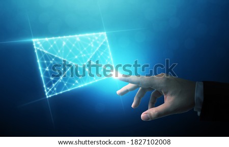 Businessman touching wireframe e-mail. Email marketing, newsletter, contact us concept Royalty-Free Stock Photo #1827102008