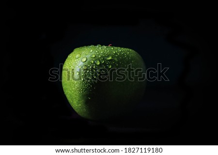 Green apple isolated with black backgound