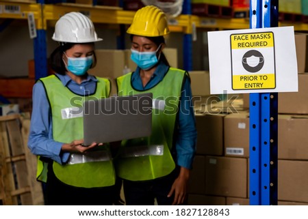 Caution sign in factory warning to industry labor worker to prevent Covid-19 Coronavirus spreading during job business reopening period after epidemic crisis . Working safely concept .