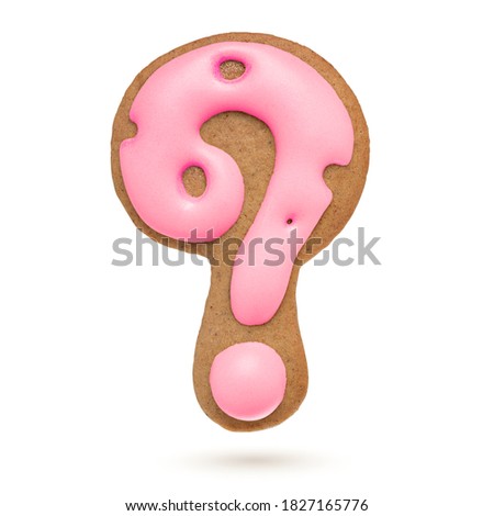 Question mark. Pink gingerbread biscuit isolated on white background. Christmas decoration.