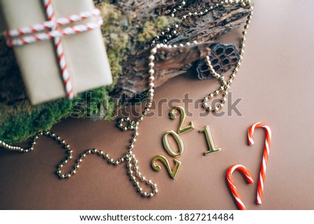 Christmas composition with natural elements and the inscription 2021. 