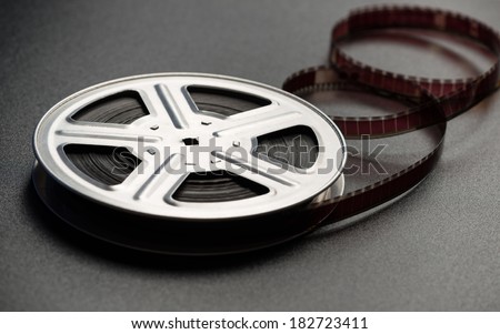Motion picture film reel on the table