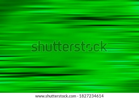 Green Abstract background with black horizontal motion blur lines. Textured backdrop