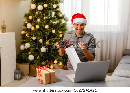 Man shopping for Christmas gifts online
