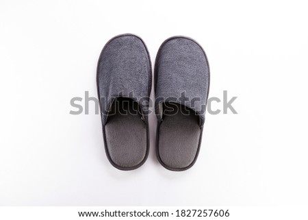 Pair of blank soft gray home slippers, design mockup. Hotel bath slippers top view isolated on white background. Clear warm domestic sandal or sneakers. Bed shoes accessory footwear. Royalty-Free Stock Photo #1827257606
