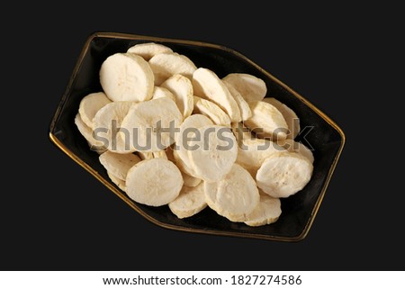 Pile of sweet dehydrated banana slices.