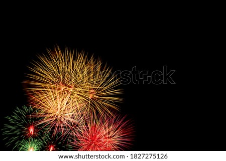 Fireworks on dark sky background with copy space; celebration and New Year anniversary concept