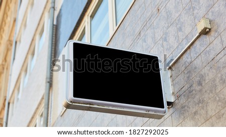 Company sign mock-up template for office or restaurant on a building in the city