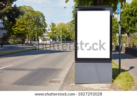 White City-Lght-Poster Mock-Up Template next to street am Tag in a German city