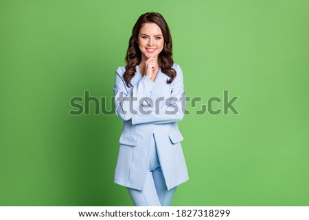 Photo of lovely lady curly hairstyle finger chin wear blue blazer pants isolated green color background