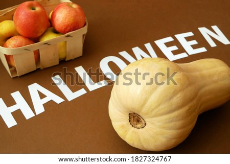 hands taking and carving big orange pumpkin into jack-o-lantern for Halloween holiday decoration, closeup, flat lay, closeup