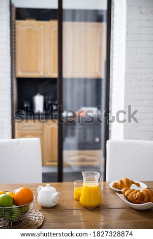 Help yourself to breakfast! Holiday breakfast in the bright kitchen. Stock photo