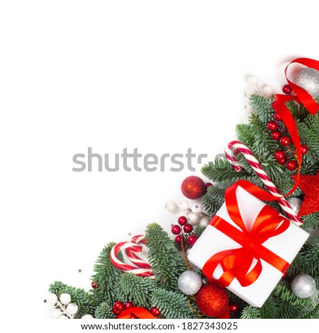 Christmas design boder frame greeting card of noble fir tree branches gift candy cane and baubles isolated on white background