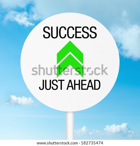 Success just ahead road sign with sky as background