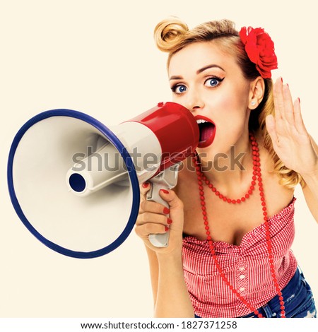 Happy excited, woman with megaphone, holding hand near her ear and shout something. Girl in pin up style, with open mouth in retro vintage studio concept. Square photo. Sales. Actions. Discount Advert