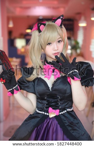 Cosplay game uniform costume young woman in pink room