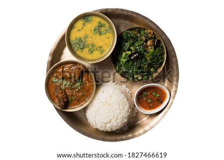 Traditional Nepalese food - thali (dal bhat) isolated on white Royalty-Free Stock Photo #1827466619