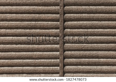 Decorative wooden wall or fence brown color modern interior logs texture background