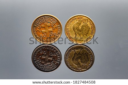 50 Cent 1943 French colonial coinage Afrique equatoriale francaise with two sides on a reflective surface. 1942-1943 years Royalty-Free Stock Photo #1827484508