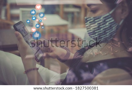 Young woman a mask is using smart phone,Social media concept.
