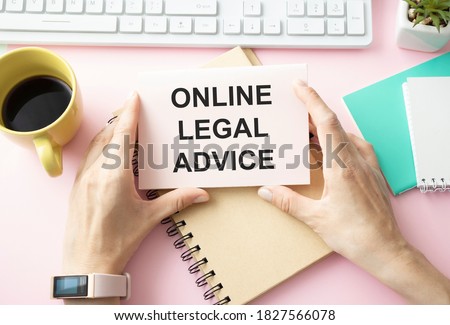 The text of legal advice online on a notepad, lying on the table.