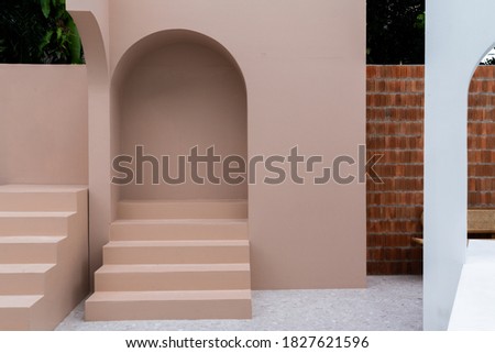 Minimal empty space scene with pink painted wall and little step with arc  for photoshoot in natural light scene / studio concept / rose pink theme / outdoor studio / modern minimal style