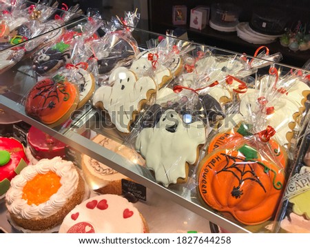 Variety of cookies decorated in style of Halloween in the pastry shop window